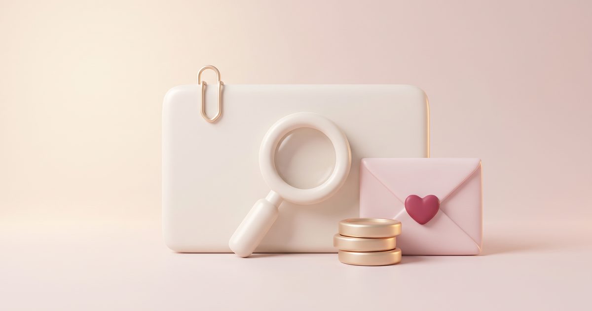 A cream invoice card with a gold paper clip, a cream magnifying glass in front of it, a blush envelope with a rose heart seal and a small stack of gold coins