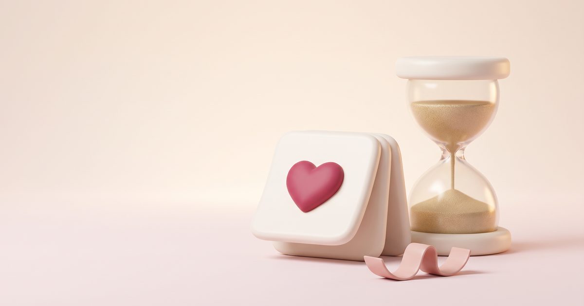 A cream hourglass beside three fanned calendar pages, one marked with a rose heart