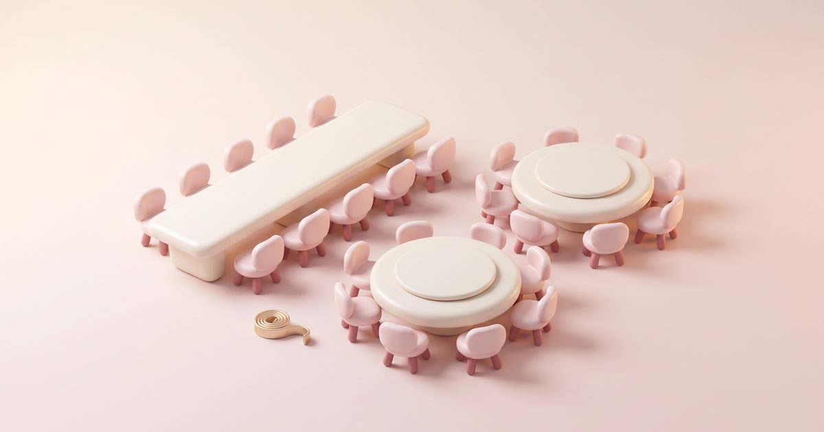 Two round cream tables and one long table ringed with blush chairs beside a small gold tape measure