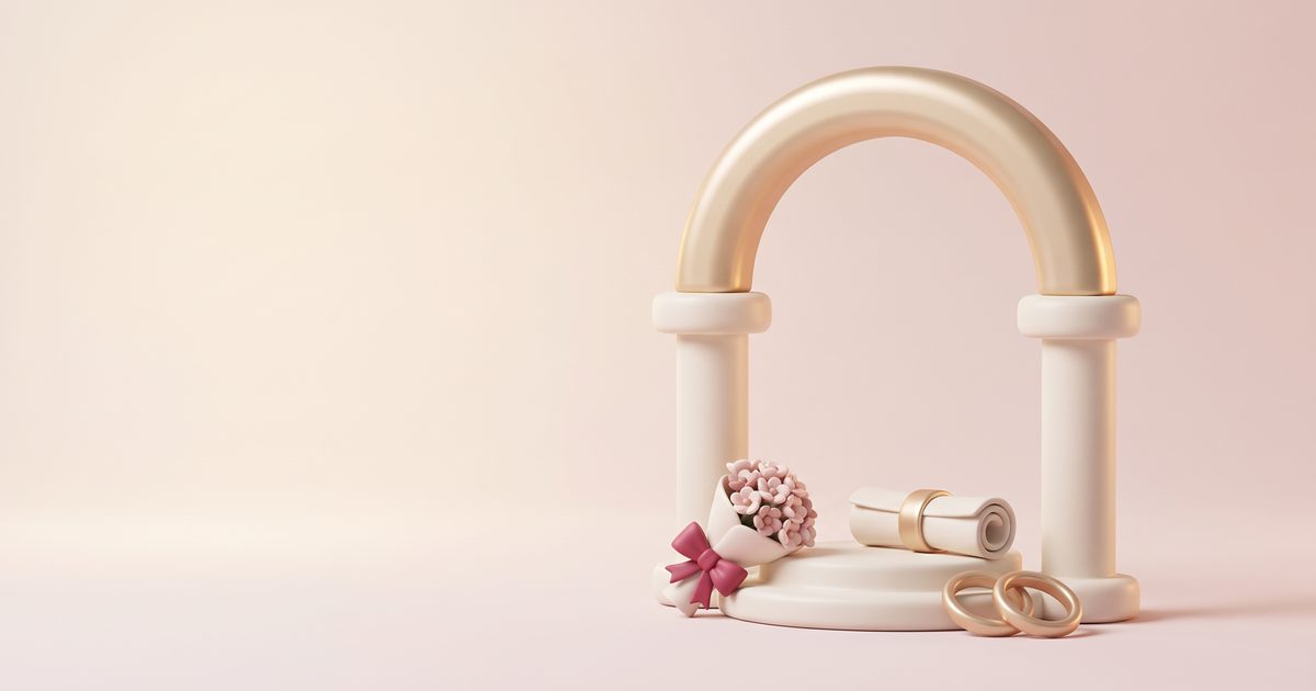 A cream arch on two columns with a small blush bouquet on the step, a rolled certificate and two gold rings