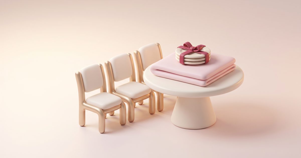 A row of cream chairs with gold frames beside a round table with a folded blush cloth and a stack of plates